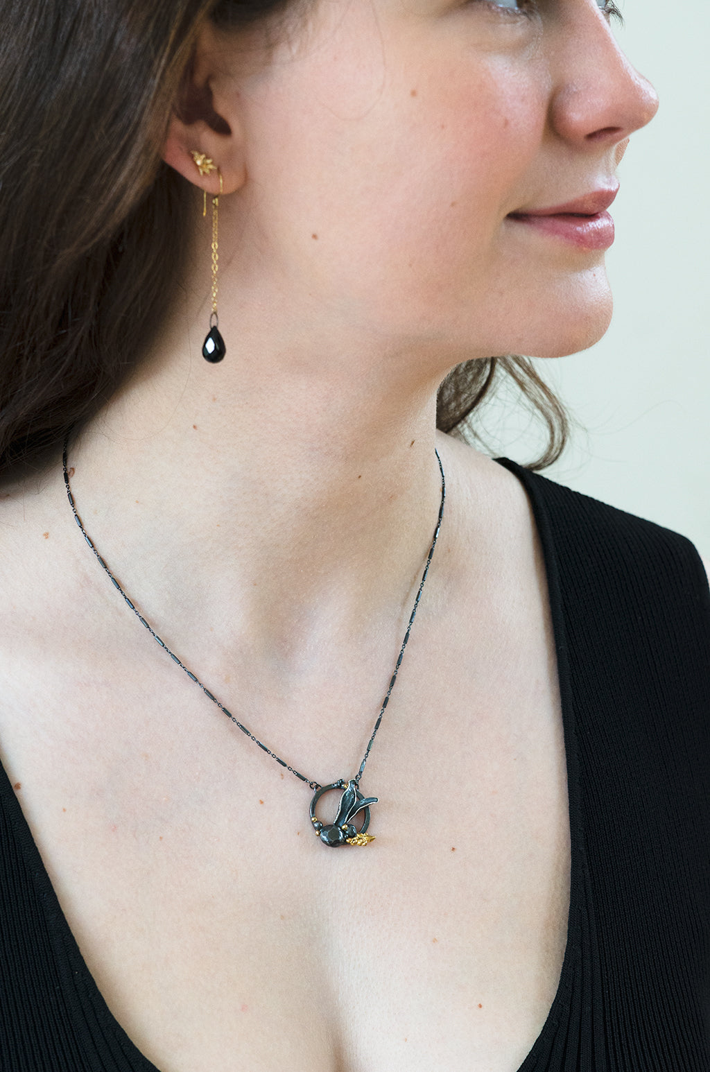 Black and gold drop earring