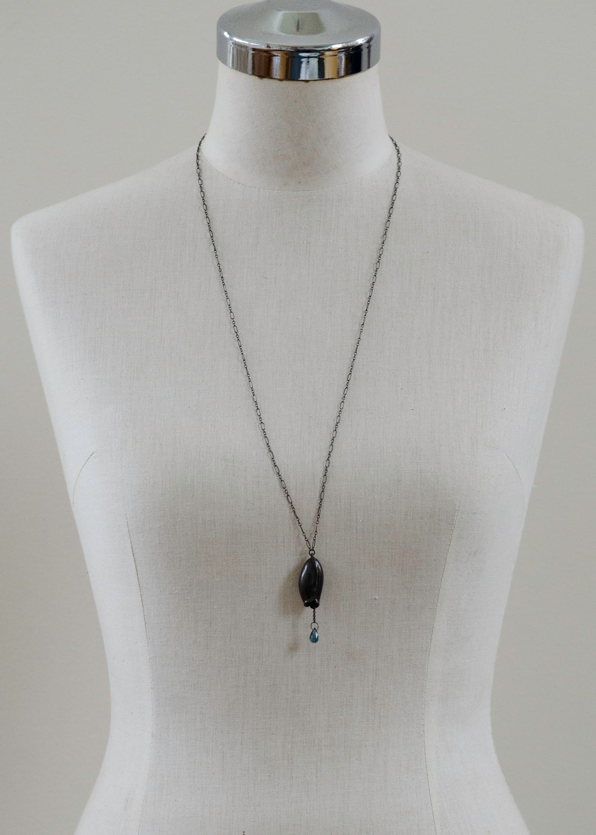 Long pod and Blue topaz necklace
